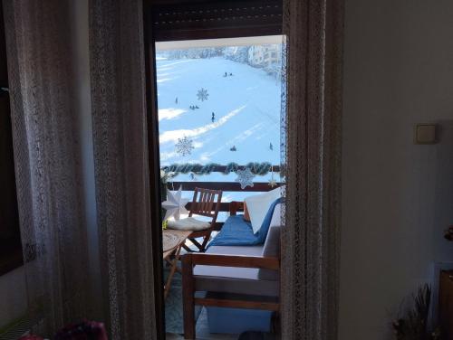 a room with a view of a ski slope through a window at Apartman Royal Vlašić in Vlasic