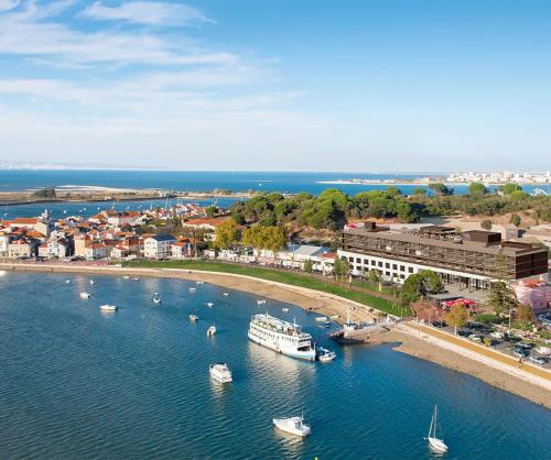 an aerial view of a harbor with boats in the water at Upon Harbor - Seixal Bay Hotel in Seixal