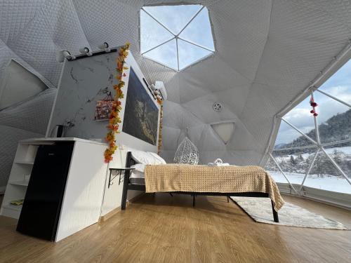 a room with a white ceiling with windows at Buddy glamping Borjomi in Borjomi