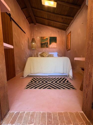 En eller flere senge i et værelse på Casa Eva Caraíva - na vila