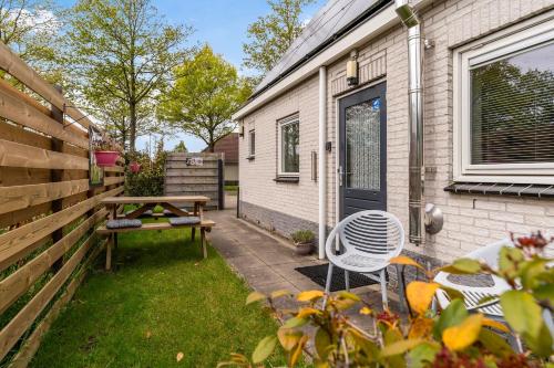 a backyard with a picnic table and a bench at Bed and breakfast Stiens in Stiens