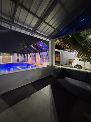 a house with a swimming pool at night at villa la pal de 4 in La Ureña