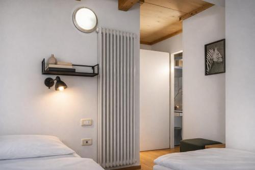 Postel nebo postele na pokoji v ubytování Windshouse Apartments