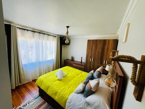 Postel nebo postele na pokoji v ubytování Hostal Ruta del Desierto