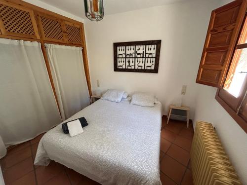 En eller flere senge i et værelse på Rural Bubion - La Alpujarra