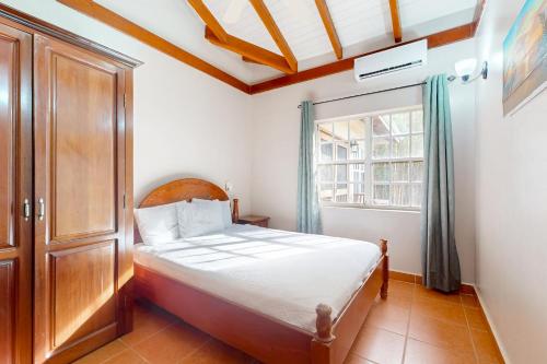 a bedroom with a bed and a window at Poseidon House in Riversdale