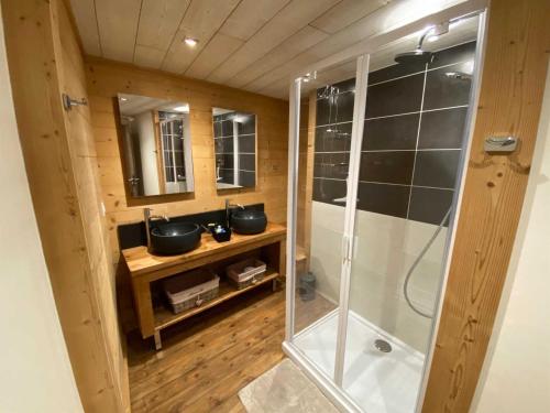 a bathroom with two sinks and a shower at Cal xiquet in Bolquere Pyrenees 2000