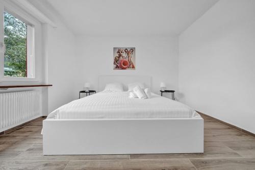 Postel nebo postele na pokoji v ubytování PEARL06 Appartement cosy près de Bienne 1D