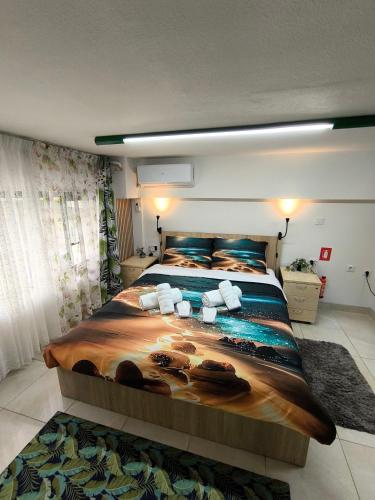 a bedroom with a large bed in a room at Emerald DesignHome near metro, tram, 10' Acropolis in Athens