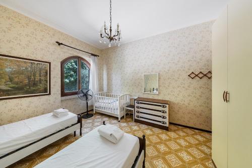 Giường trong phòng chung tại Daller Bianca by Whale Homes