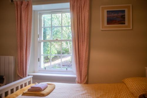 En eller flere senge i et værelse på Wester Campsie Farm House