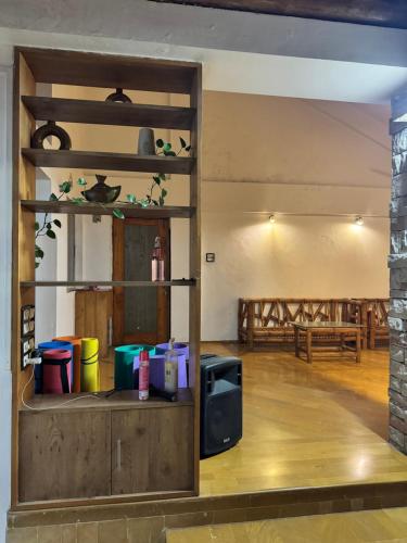 a living room with a tv and a table at Meridian penthouse in Kolhapur