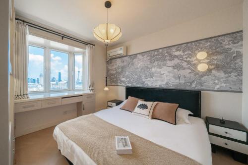 Giường trong phòng chung tại Tonight Homestay East Nanjing Road Shanghai