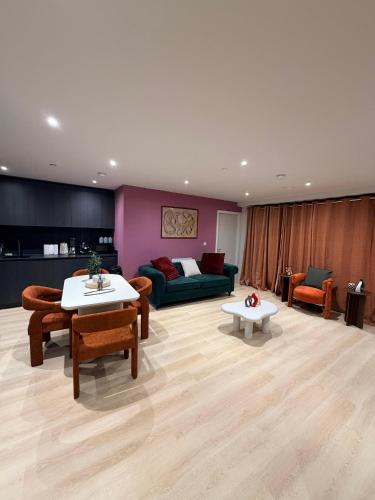 a living room with a couch and a table at Luxury 2bed flat around Manchester Victoria St in Manchester
