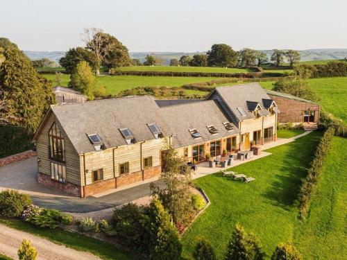 an aerial view of a large house in a field at Bedw Barn in Newtown