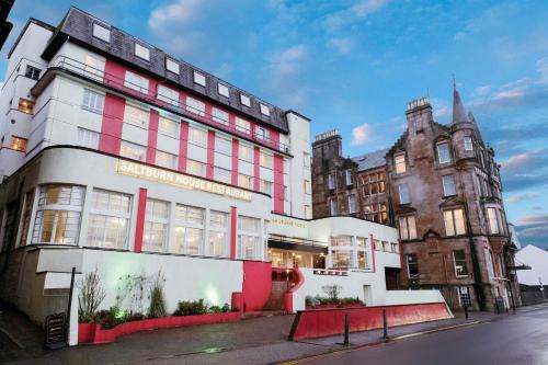a building on the corner of a street at Muthu Oban Regent Hotel in Oban