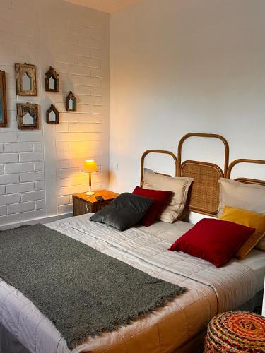 En eller flere senge i et værelse på Villa d’ô