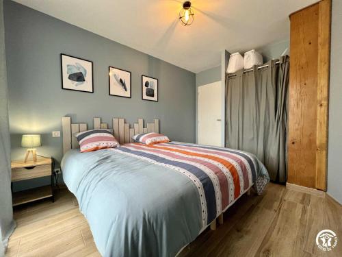 a bedroom with a bed and a table and a window at Gite du tatou in Roquefeuil
