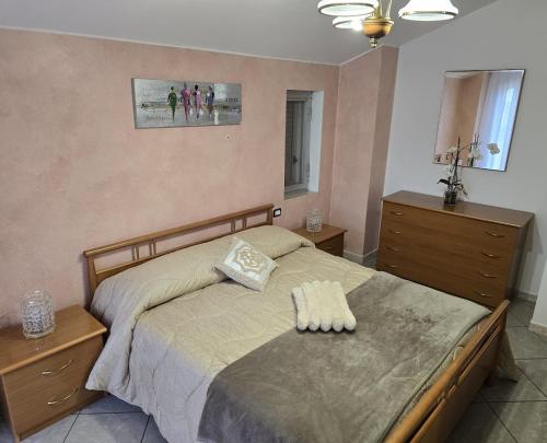 a bedroom with a large bed with two dressers and a bed sidx sidx sidx at Mely House centralissimo in Castel di Sangro