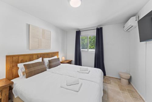 Giường trong phòng chung tại Caribe CBW Hotel