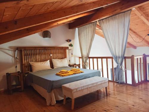 a bedroom with a bed in a room with wooden ceilings at Sal&Love apt in Porto Antigo in Santa Maria