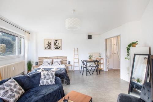 Posezení v ubytování L'Eden Appart, Fibre, Garage, Balcon, Calme et Cosy