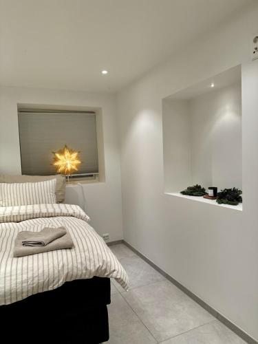 a bedroom with a bed and a mirror on the wall at Tromso Panorama in Tromsø