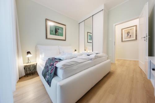 En eller flere senge i et værelse på Apartmán Verdi