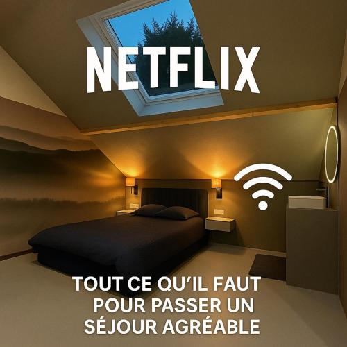 a bedroom with a bed with a window and a sign that reads notify at L'annexe 3 - Cosy studio Dole in Foucherans