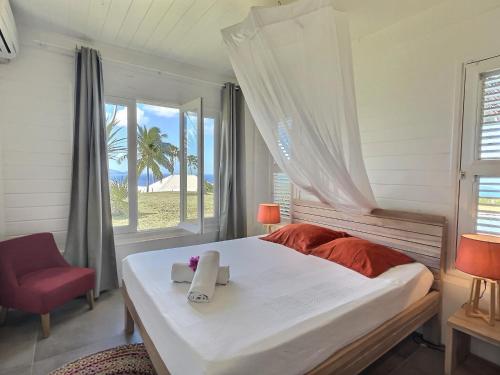 Giường trong phòng chung tại VILLA AQUA