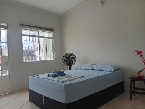 Giường trong phòng chung tại Capsula Residence Hotel