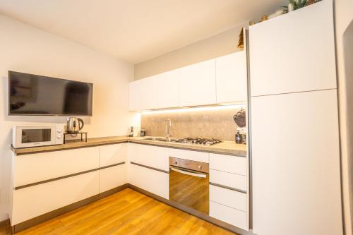 Køkken eller tekøkken på Moderno appartamento con giardino