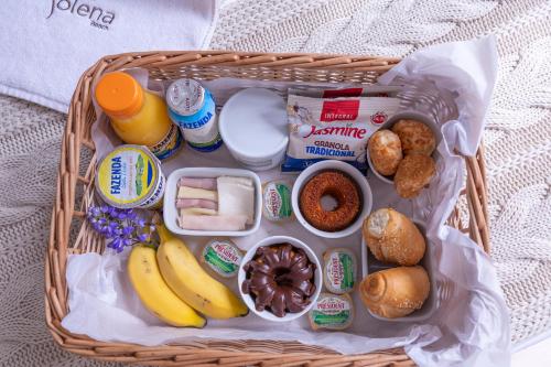 a basket filled with food and other food items at Solena in Camburi