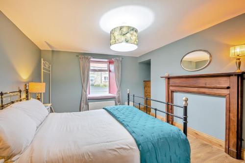 a bedroom with a bed and a fireplace at 2 Bed in Lowick oc-c34008 in Lowick
