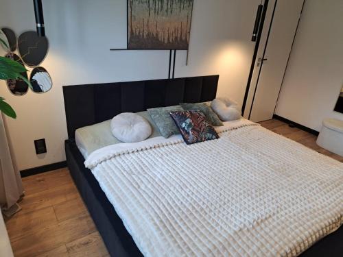 En eller flere senge i et værelse på Apartament Patka Wysoki STANDARD