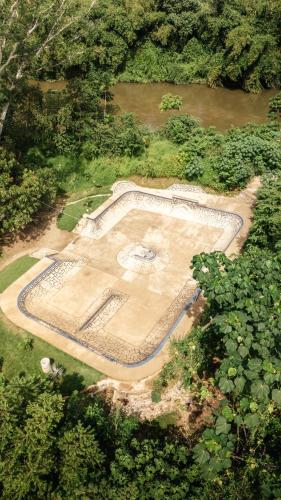 an aerial view of a park in the middle of a forest at La Playita in Guachaca