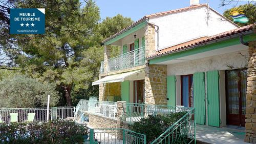 a building with a sign in front of it at villa Terre Brûlée in Ceyreste