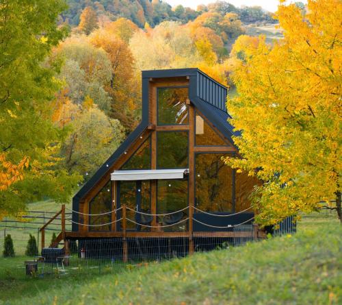 a gazebo in the middle of a field with trees at NorAtlas Heritage - Adults Only in Varlămul