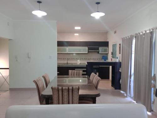 a kitchen with a table and chairs in a room at San Juan Santo Tome in Santo Tomé