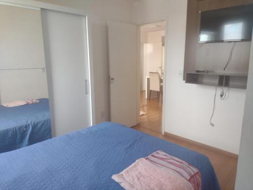 Postel nebo postele na pokoji v ubytování apto completo c garagem