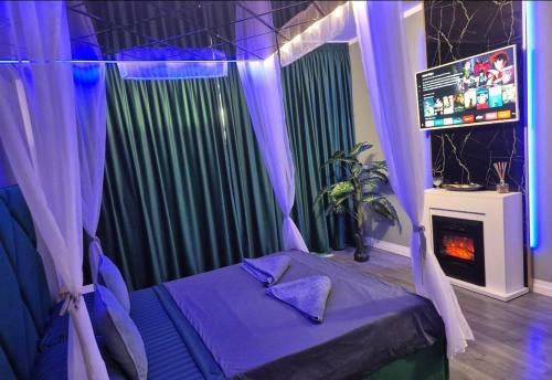 a bedroom with a bed with purple curtains at AFI Discret Jacuzzi in Bucharest