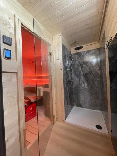 a walk in shower in a tiny house at Aura Baltic in Rewal
