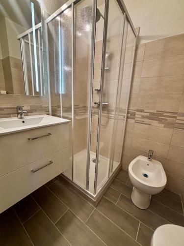 a bathroom with a shower and a sink and a toilet at Cosy studio plages Antibes in Antibes