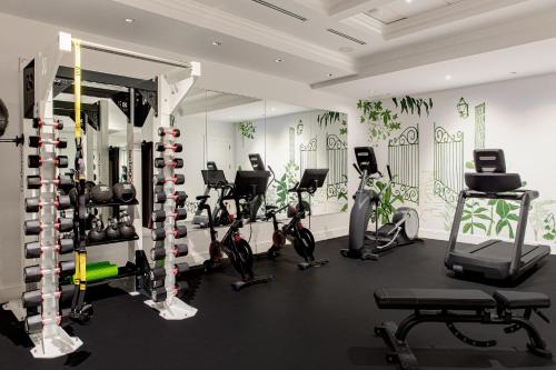 a gym with a bunch of exercise bikes in a room at The Spectator Hotel in Charleston