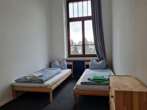 En eller flere senge i et værelse på Ausblick Freital 4