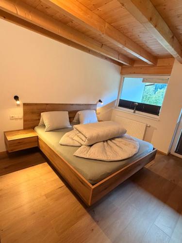 a bedroom with a bed with two pillows on it at Haus Antonia in Kauns