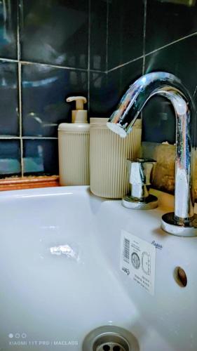 a sink with a faucet on top of a counter at La Cordillera in Tupungato