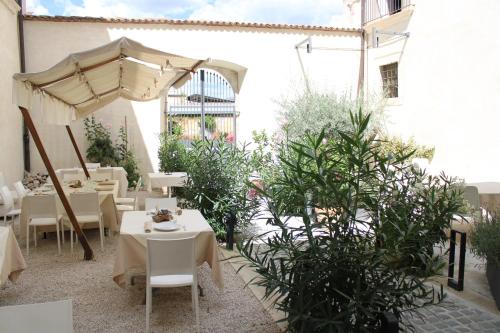 En terrasse eller udendørsområde på Qui e Lá - B&B