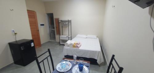 En eller flere senge i et værelse på Stúdio em ótima localização