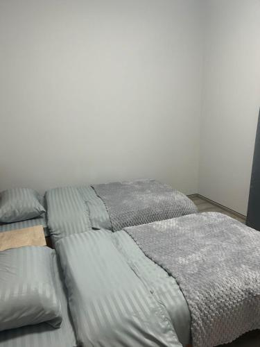 Postel nebo postele na pokoji v ubytování Grigor's Guestgouse 2